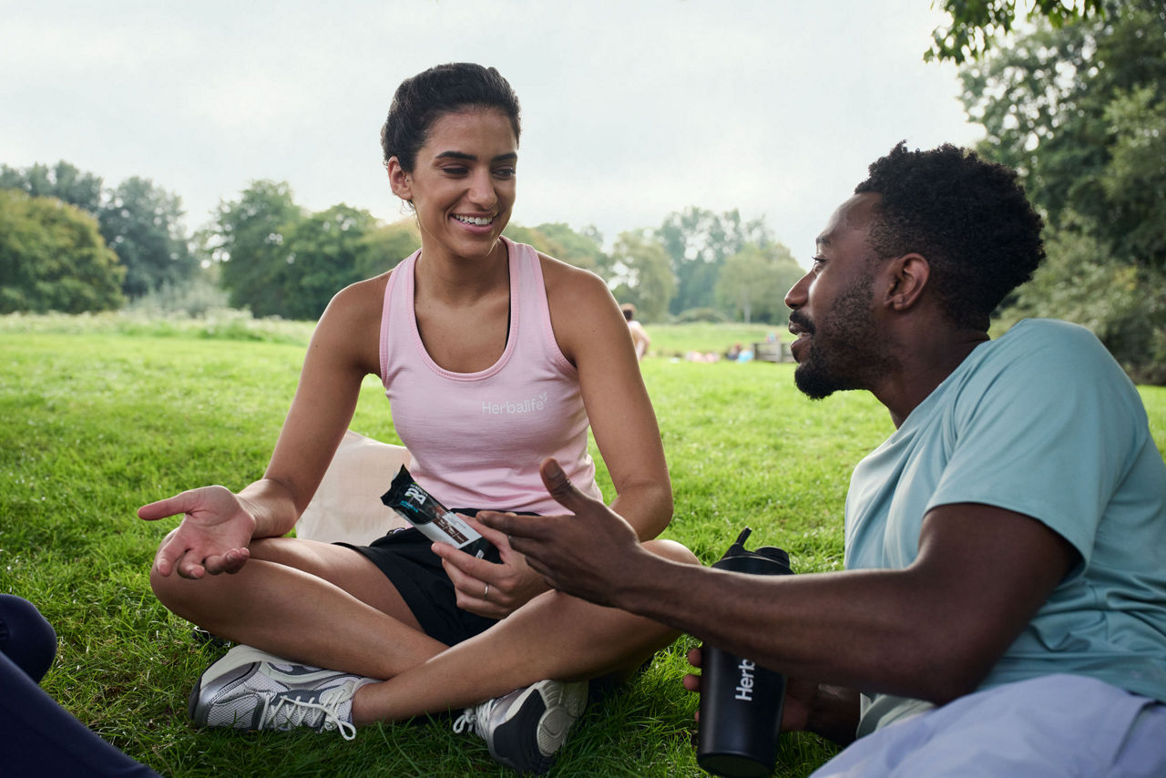 Friends having a conversation in the park